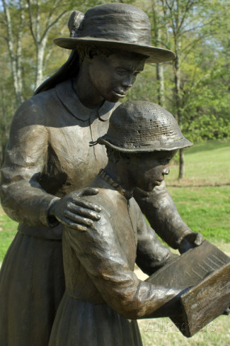 Statue of freed slave woman teaching girl to read at union army contraband camp